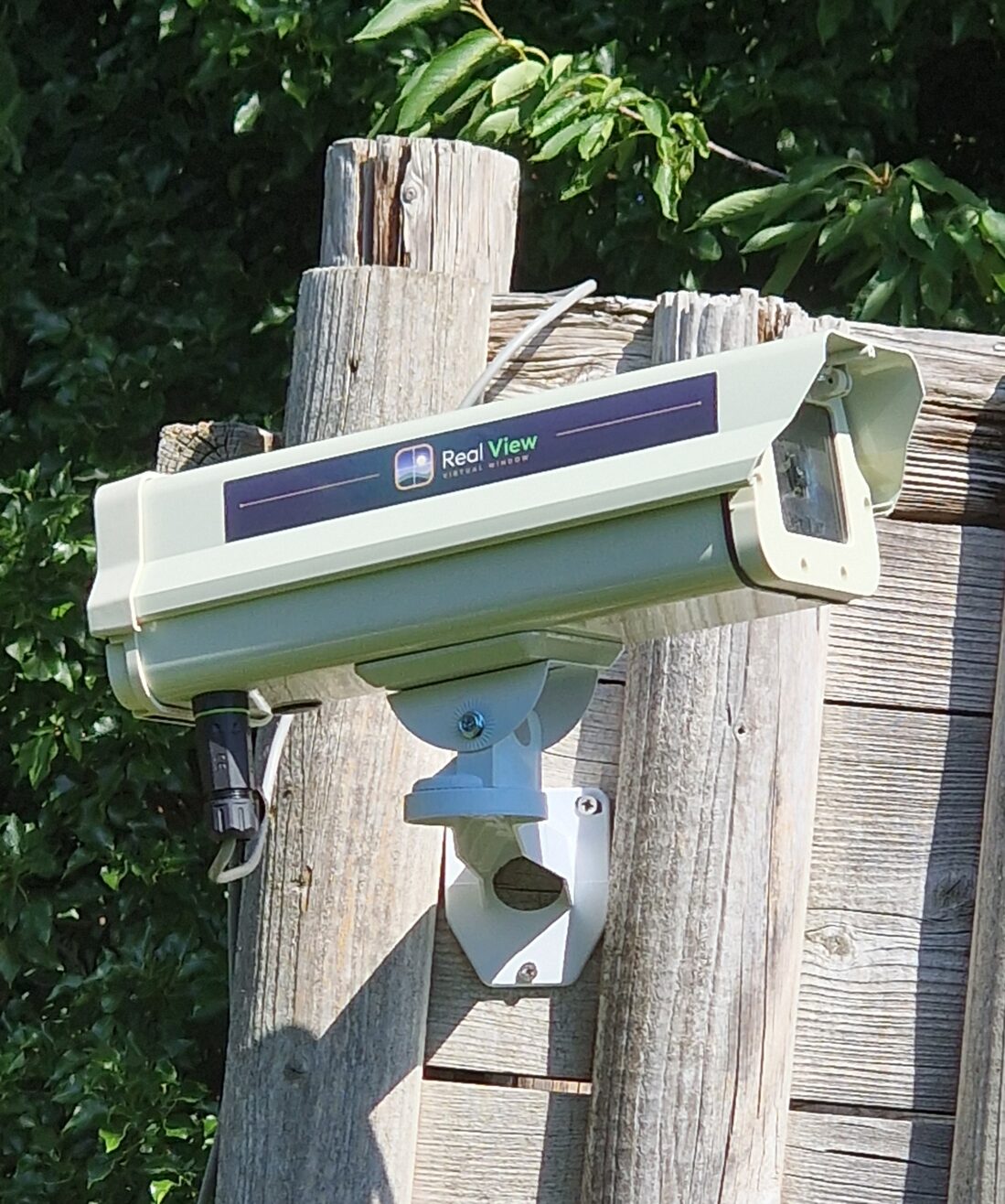 The StreamingCams weatherproof camera installed outdoors, streaming a live view
